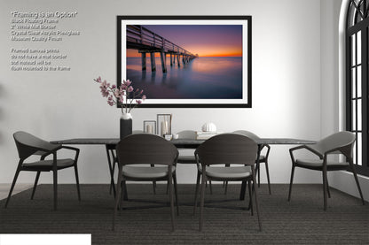 a picture of a dining room with a table and chairs