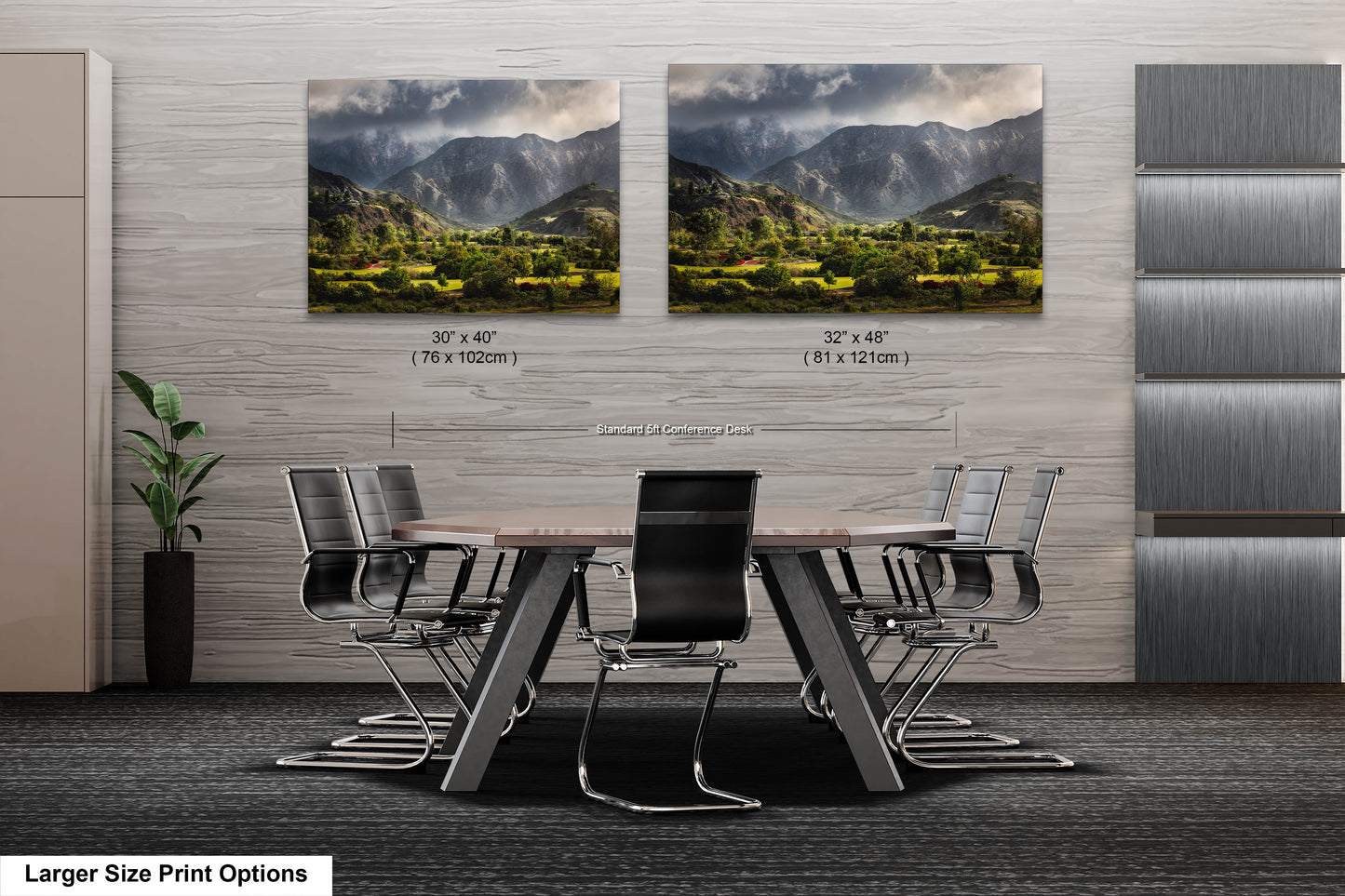 a dining room table with chairs in front of two pictures of mountains