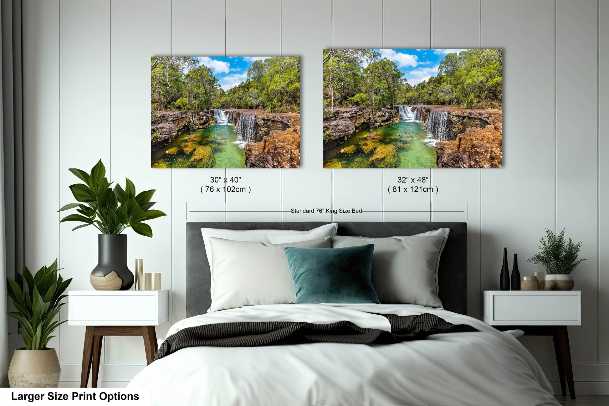 a bedroom with two pictures of a waterfall and a bed