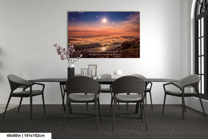 a dining room table with chairs and a painting on the wall