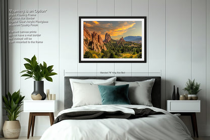 a bedroom with a bed and a picture hanging on the wall