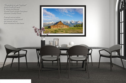 a picture of a dining room with a table and chairs