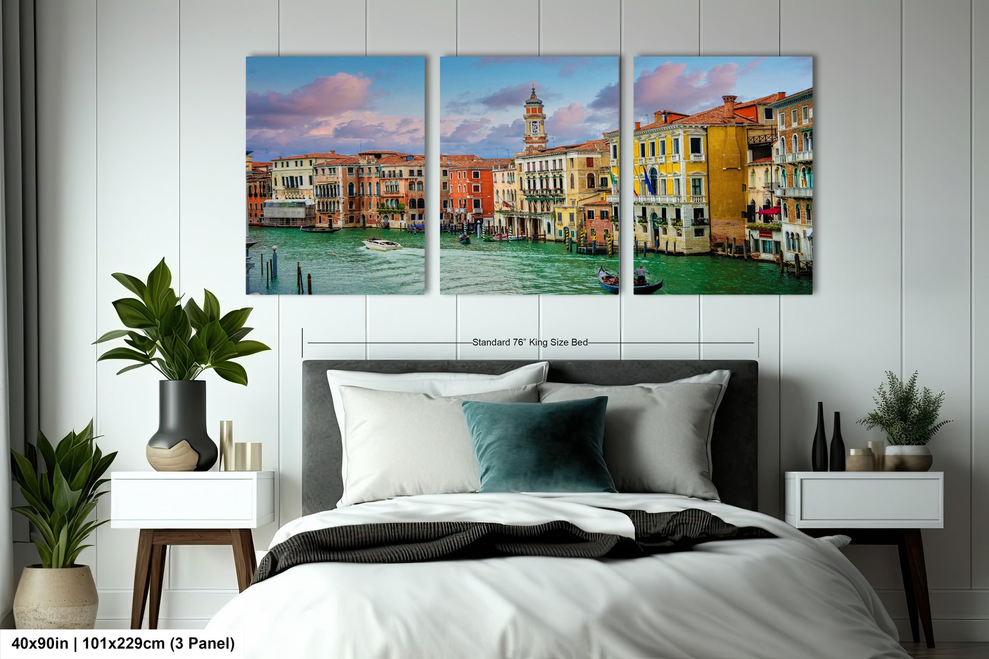 a bedroom with a large bed and three paintings on the wall