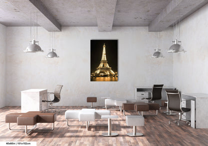 a room with chairs, a desk and a picture of the eiffel tower