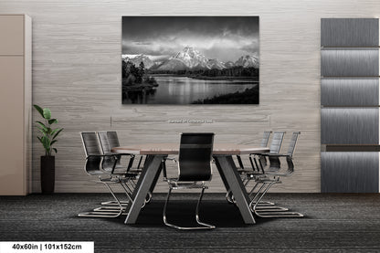 a black and white photo of a table and chairs