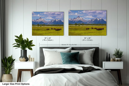 a bedroom with a bed and two pictures on the wall