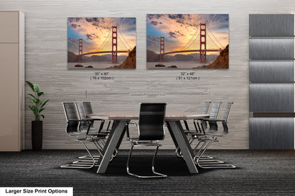 a dining room table with chairs and a picture of the golden gate bridge