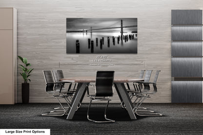 a black and white photo of a table and chairs