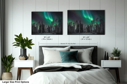 a bedroom with a bed and two pictures on the wall