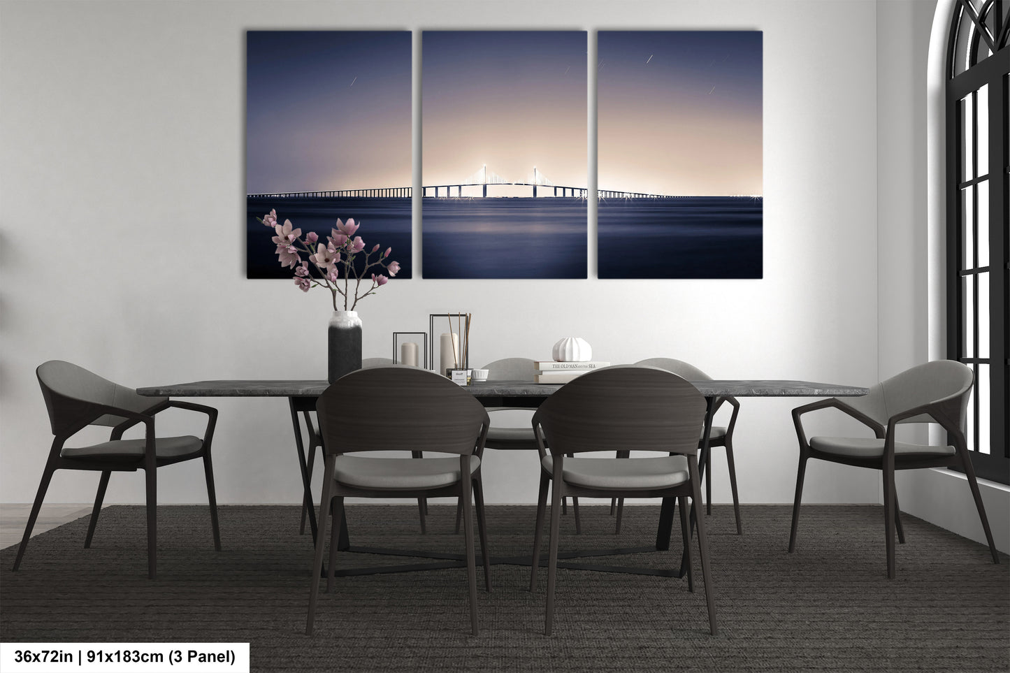 a dining room with a table and four chairs
