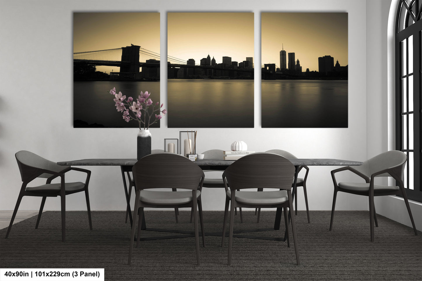 a dining room table with four chairs and a vase of flowers