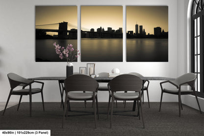 a dining room table with four chairs and a vase of flowers