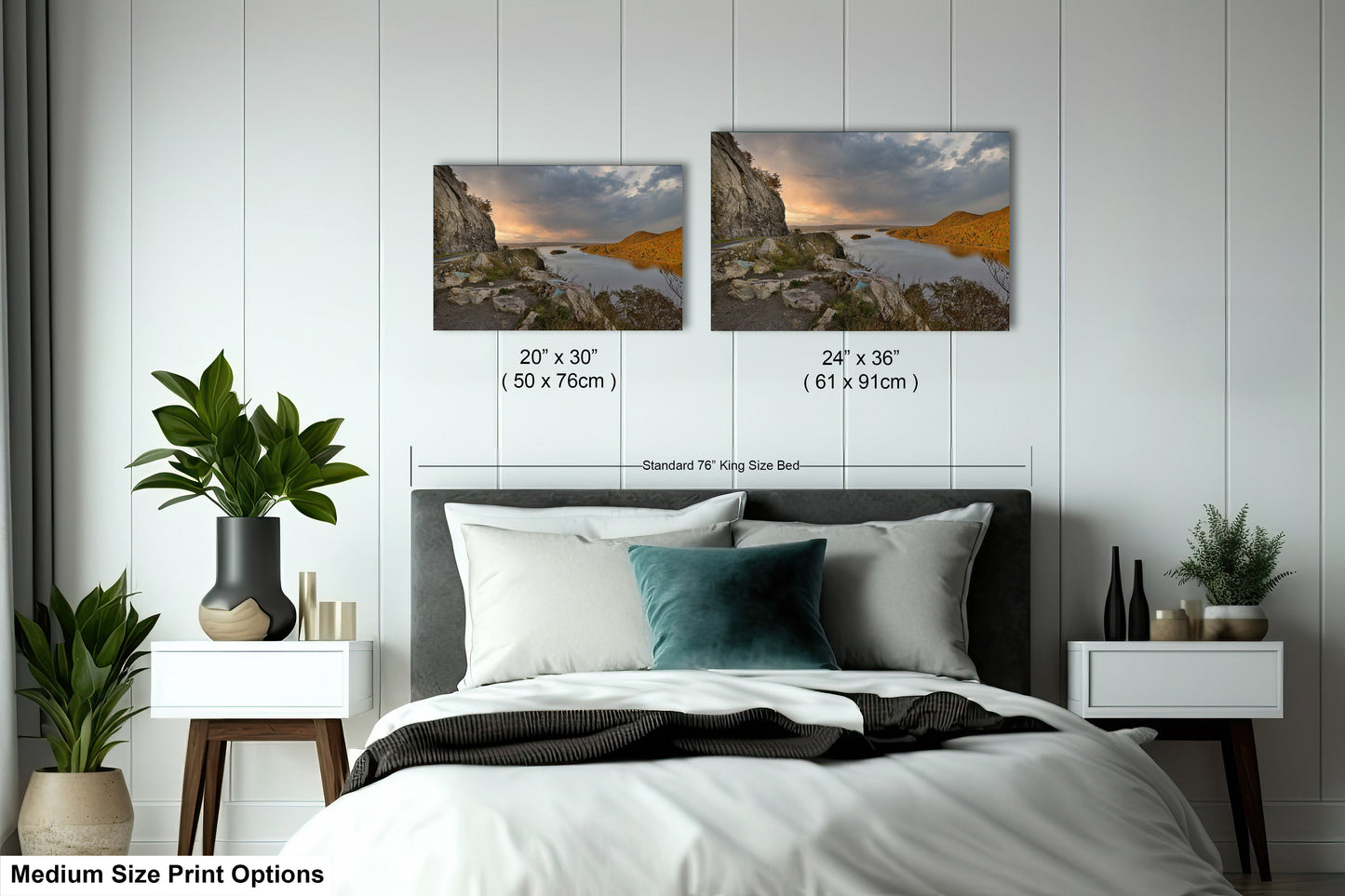 a bed with two pictures on the wall above it