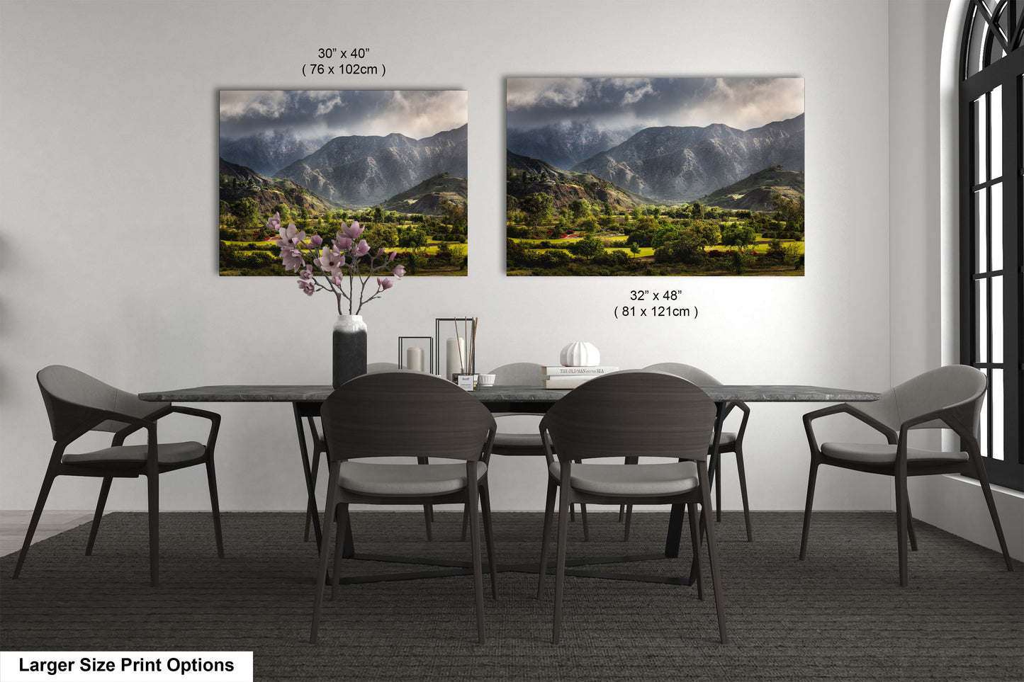 a dining room table with chairs and a vase of flowers