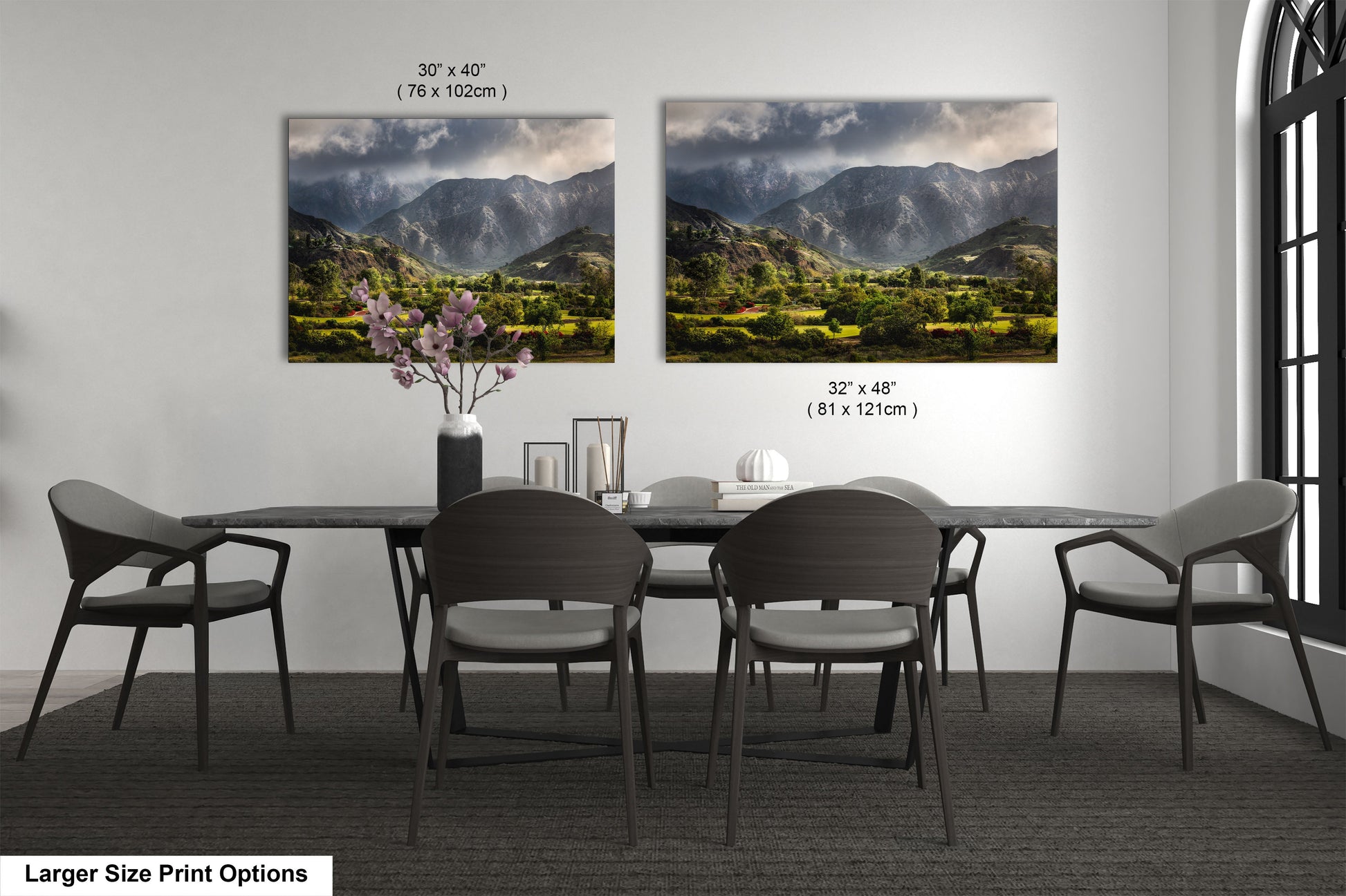 a dining room table with chairs and a vase of flowers