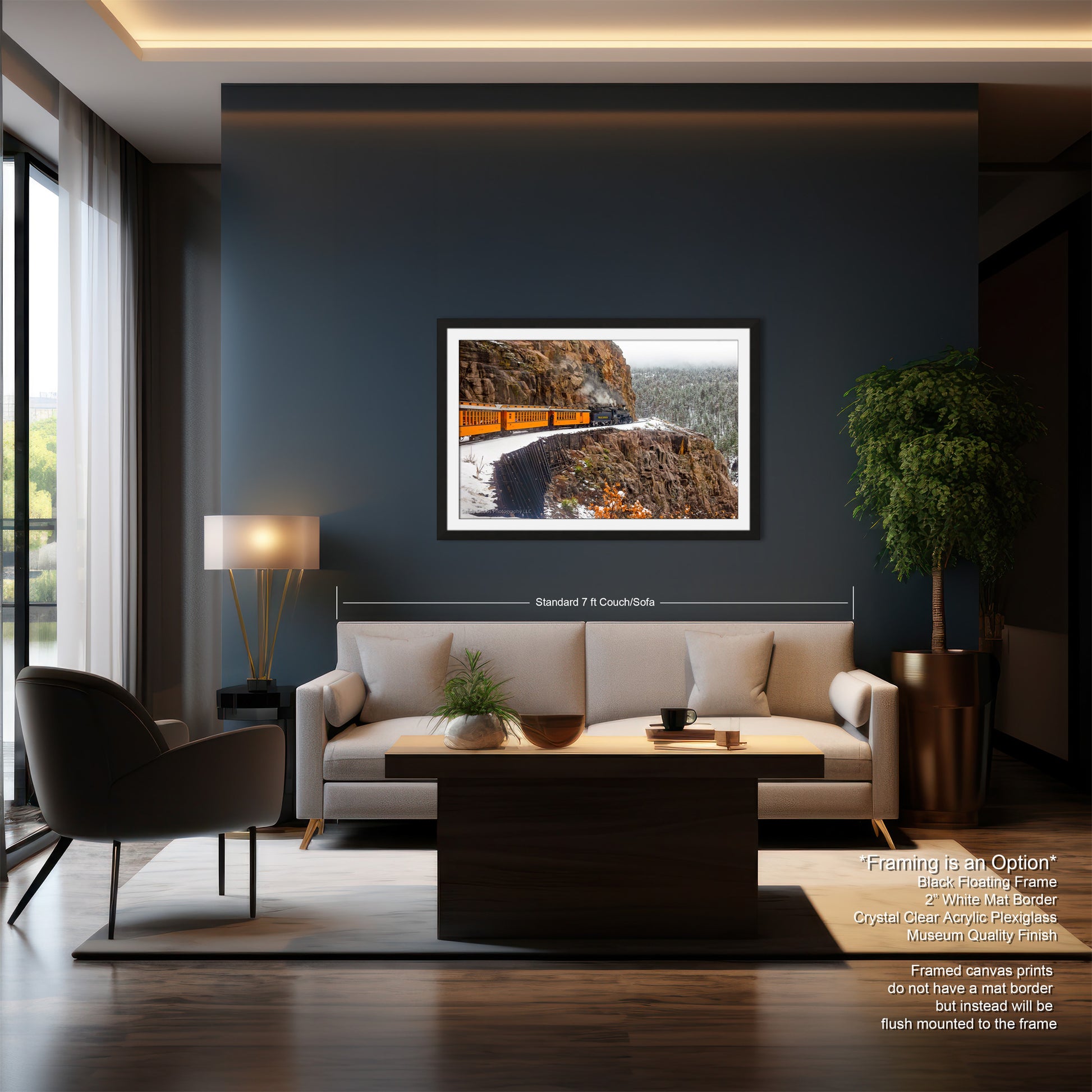 a living room with a couch a chair and a painting on the wall