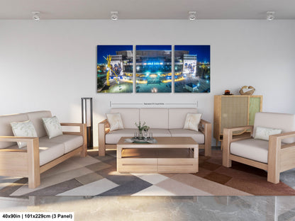 a living room filled with furniture and a painting on the wall