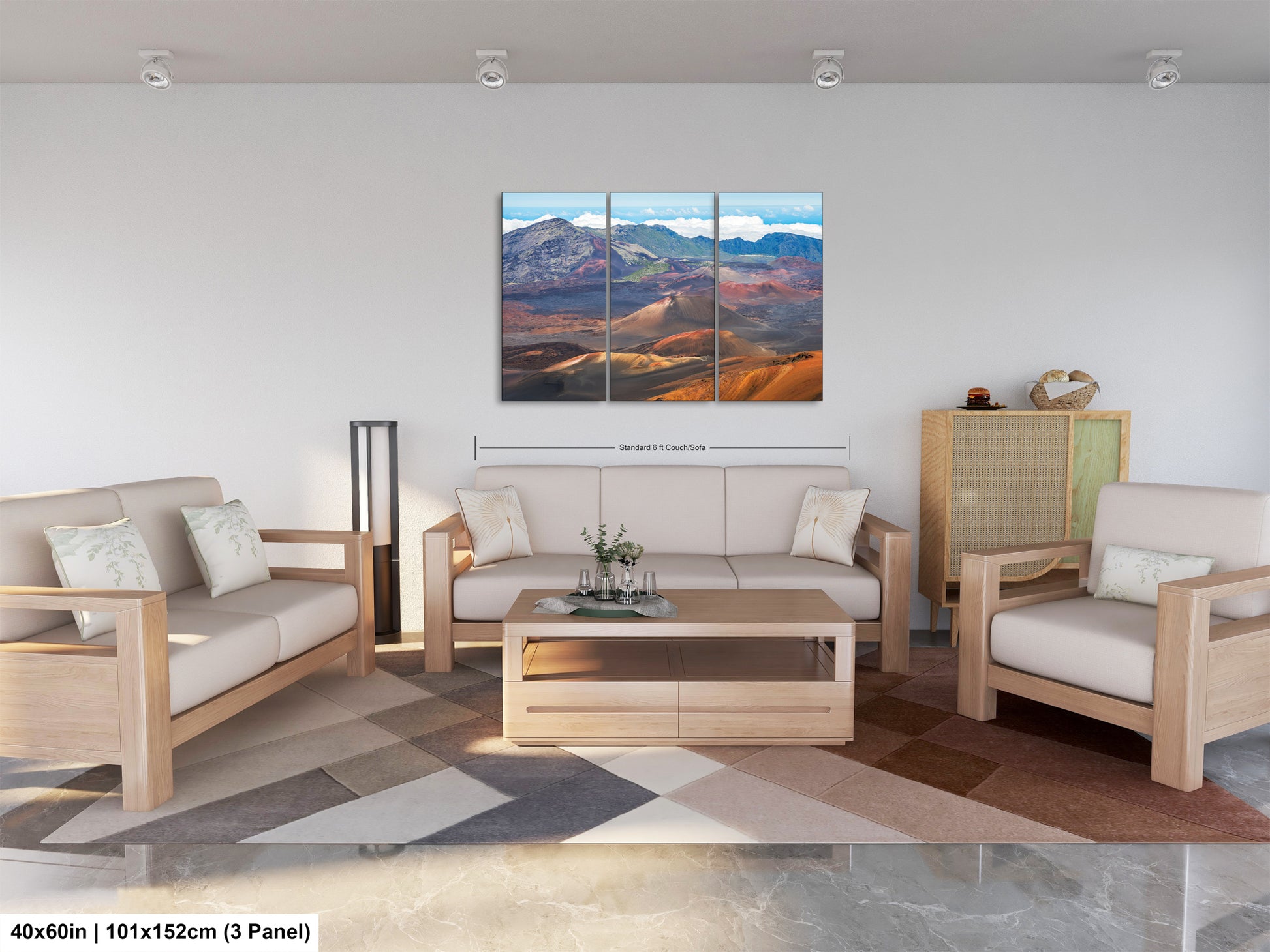 The image is a modern living room with a large, three-panel landscape painting hanging on the wall. The painting depicts a mountainous, desert-like scene with a mix of red, orange, and blue colors. The room is furnished with a sofa, two armchairs, and a coffee table, creating a comfortable and inviting atmosphere.