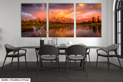 a dining room table with chairs and a painting on the wall