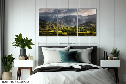 a bed room with a neatly made bed and a painting on the wall