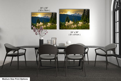 a dining table with four chairs and a vase of flowers