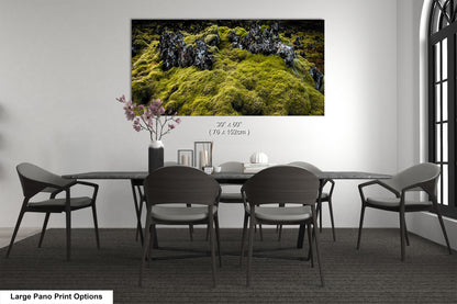 a dining room table with chairs and a painting on the wall