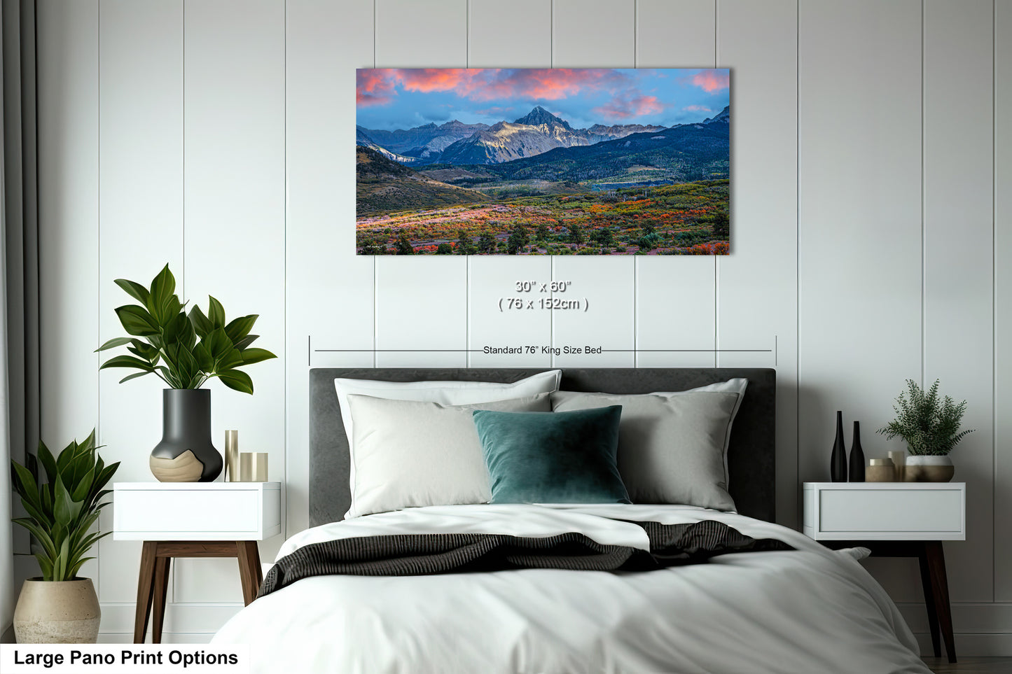 a bedroom with a bed and a painting on the wall