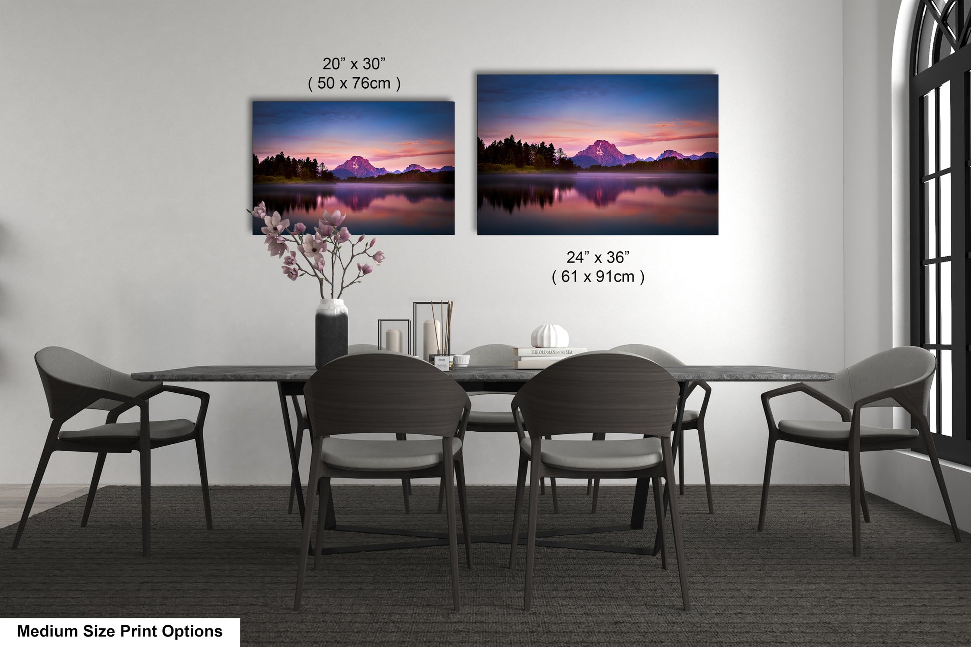 a dining table with four chairs and a vase of flowers