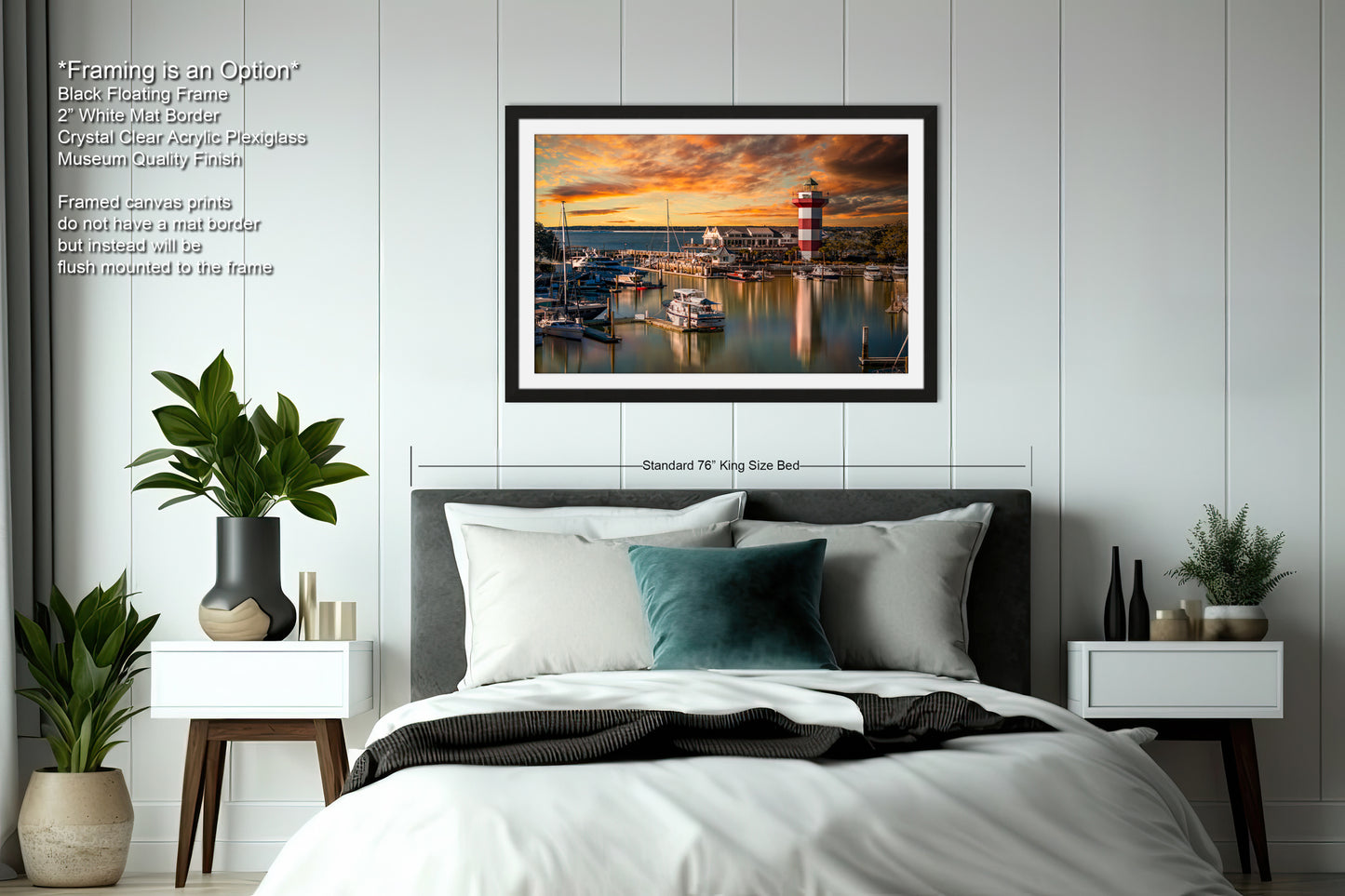 a bedroom with a bed and a picture hanging above it