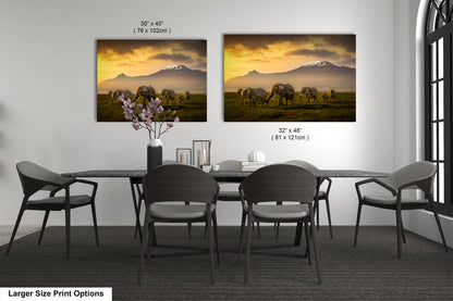 a dining room table with four chairs and a vase of flowers