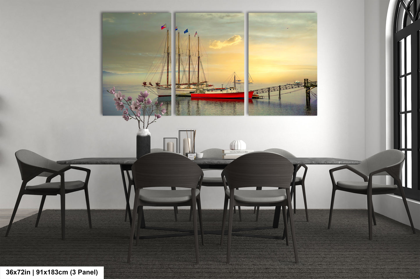 a dining room table with chairs and a painting on the wall