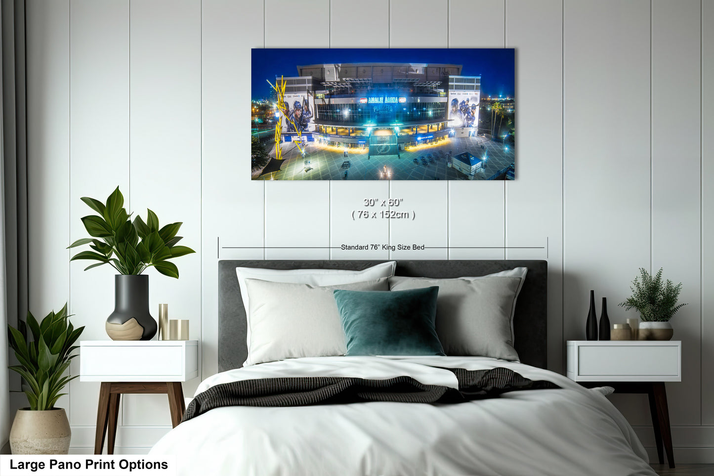a bedroom with a large bed and white walls