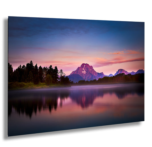 a lake with a mountain in the background