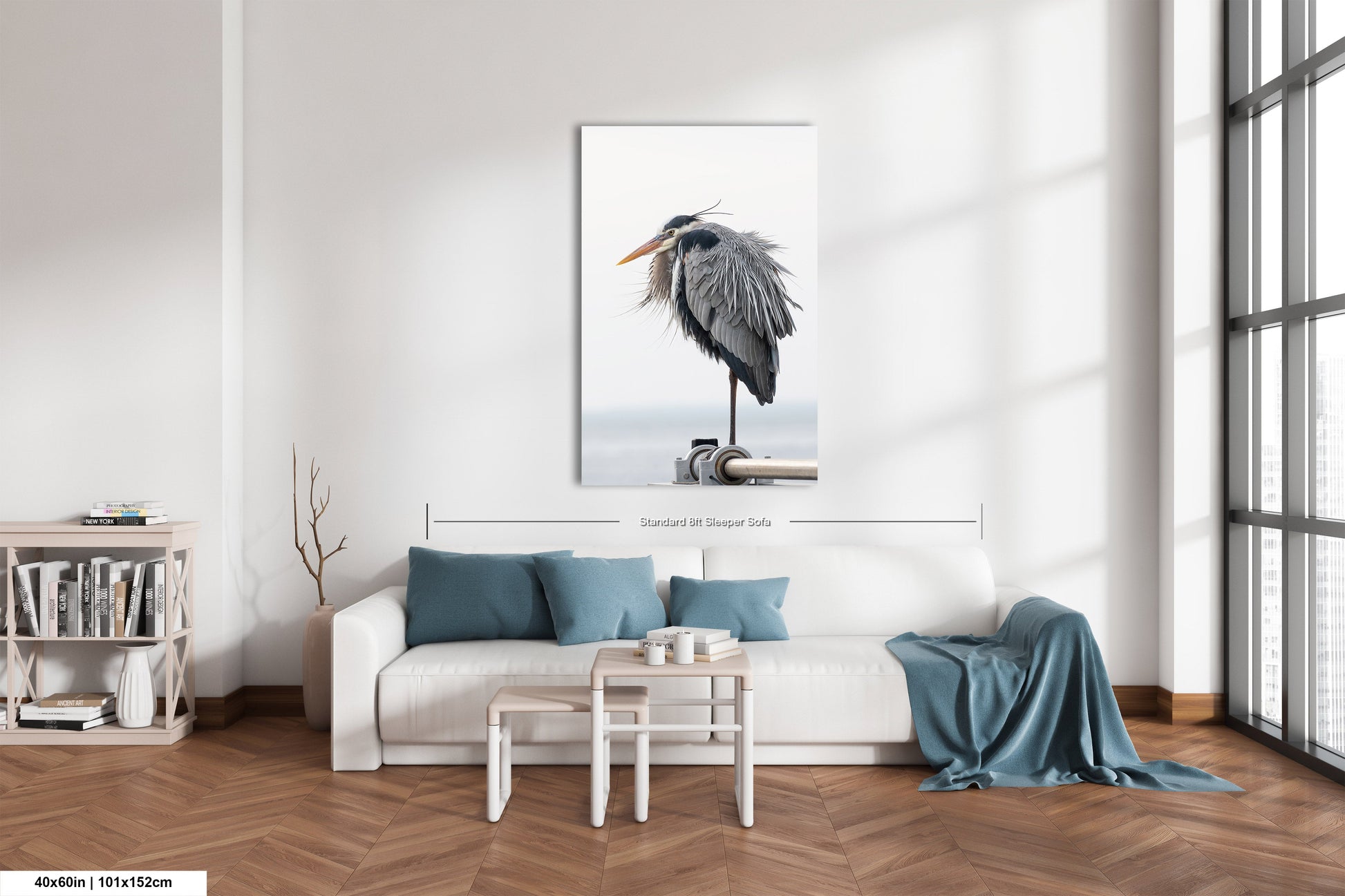 a living room with a white couch and a painting on the wall