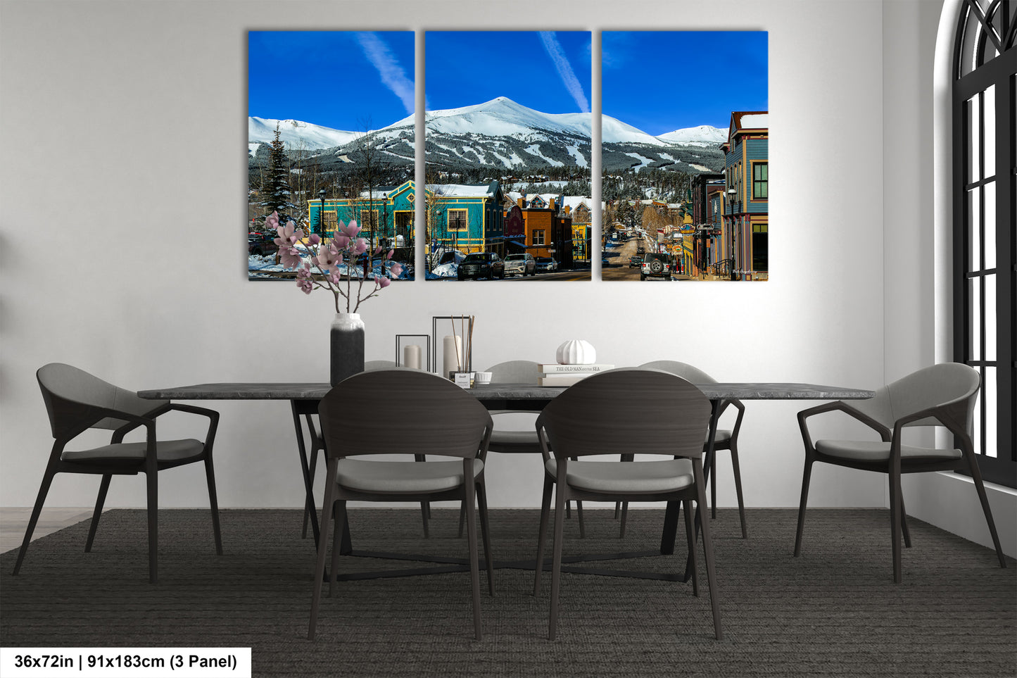 a dining room with a table and chairs