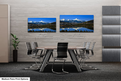 a dining room table with a view of a mountain range