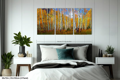 a bedroom with a bed and paintings on the wall