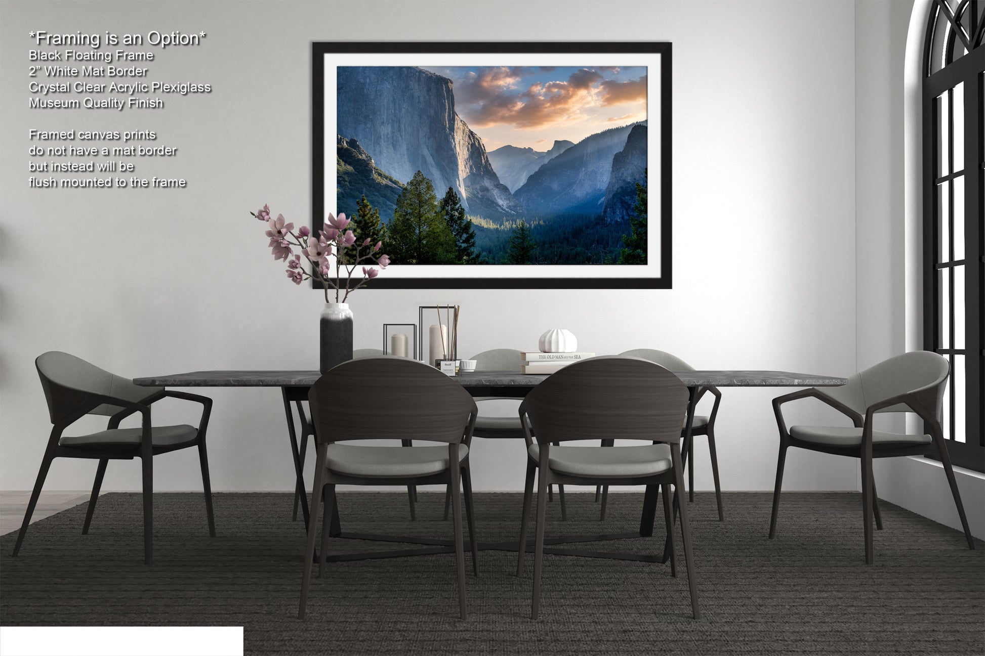 a dining room table with chairs and a picture hanging on the wall