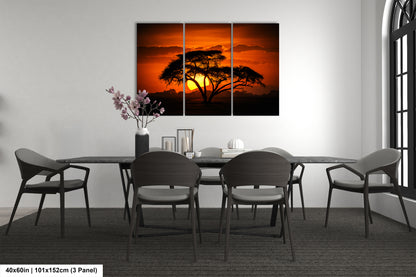 a dining room table with chairs and a painting on the wall