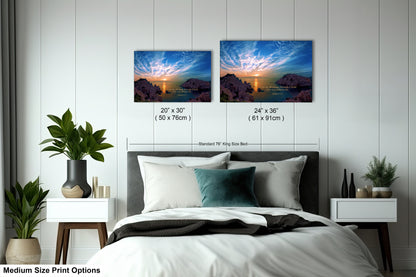 a bed with two pictures on the wall above it