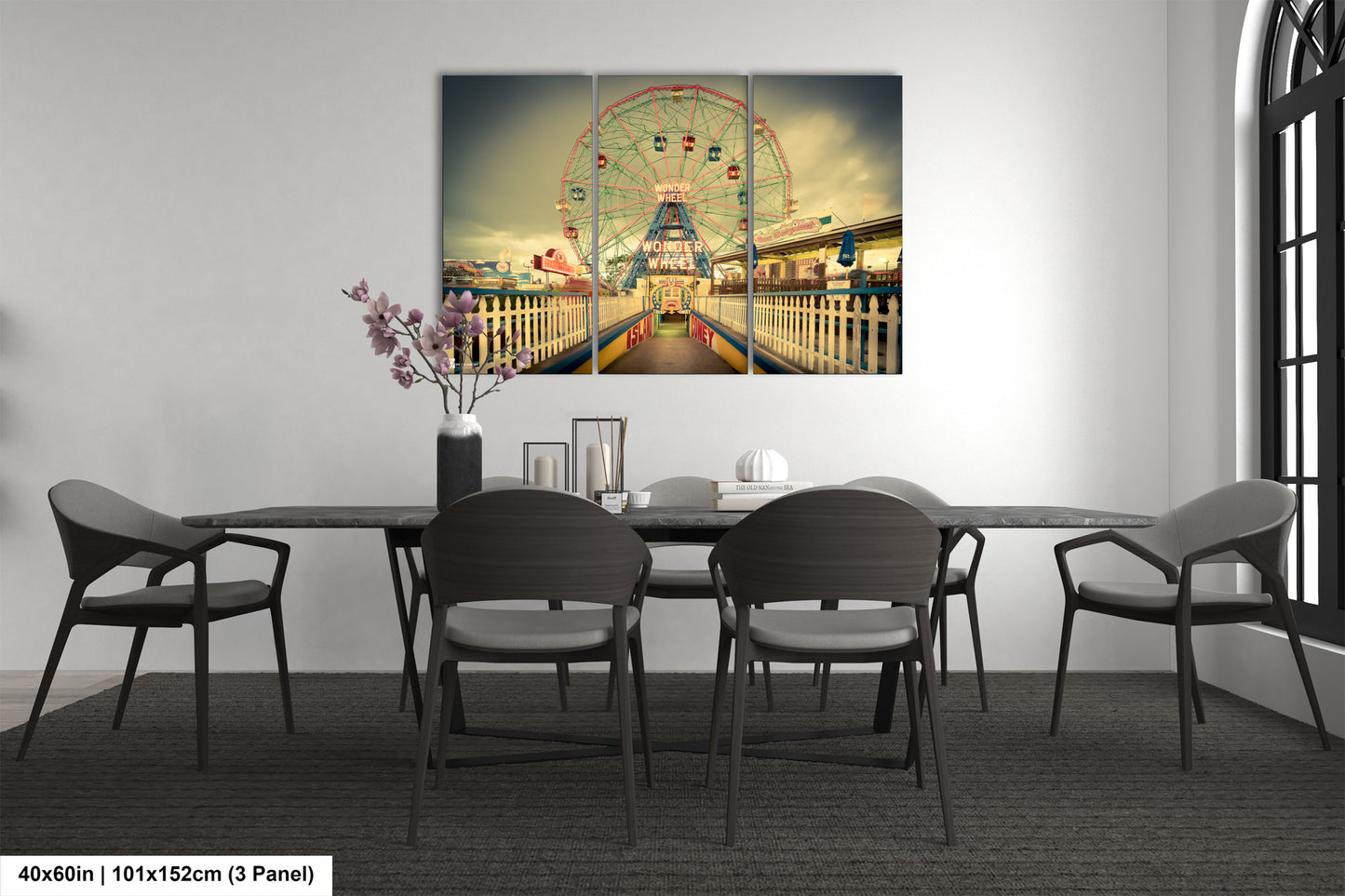 a dining room table with a ferris wheel in the background