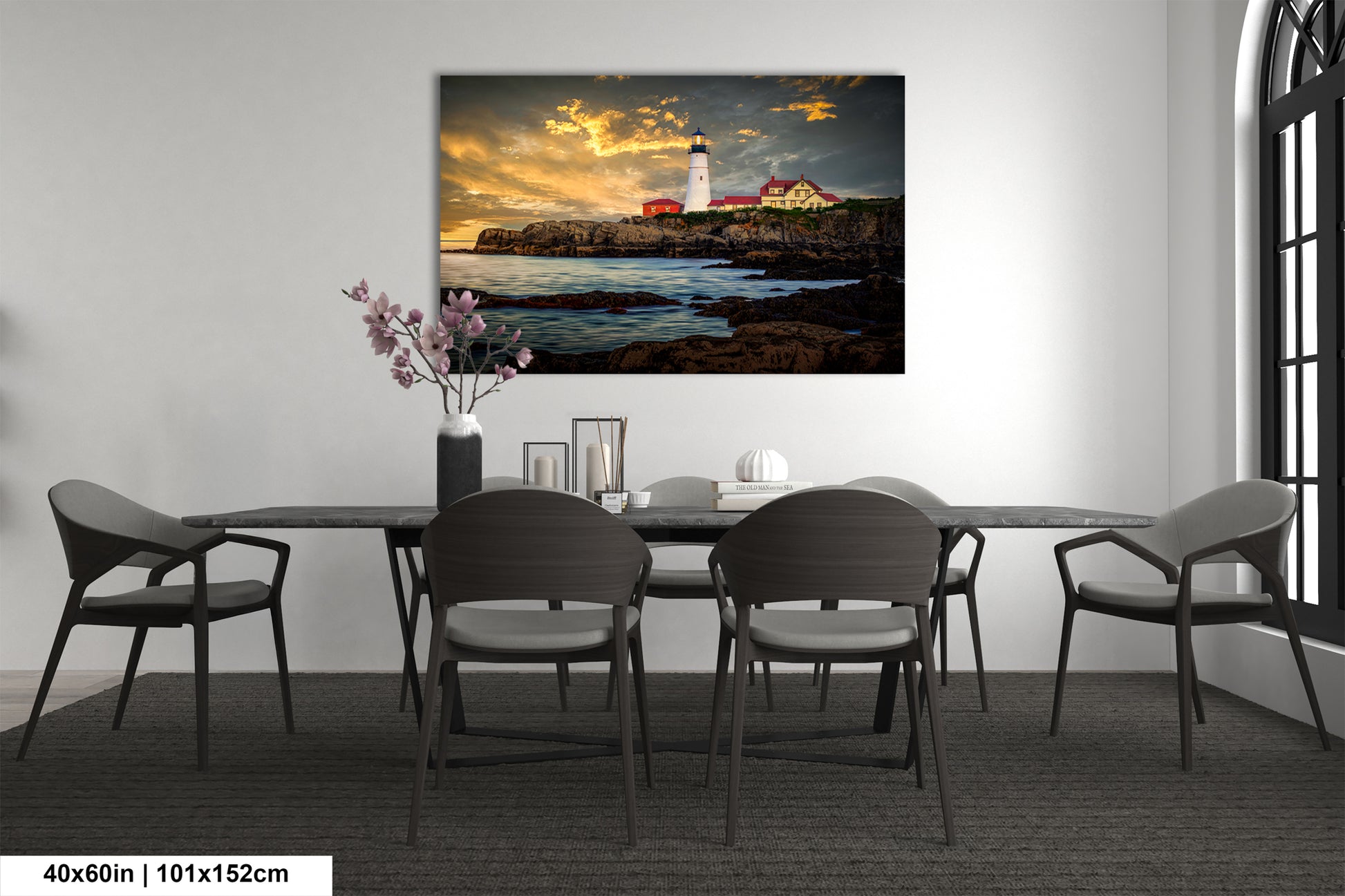 a dining room table with chairs and a painting on the wall