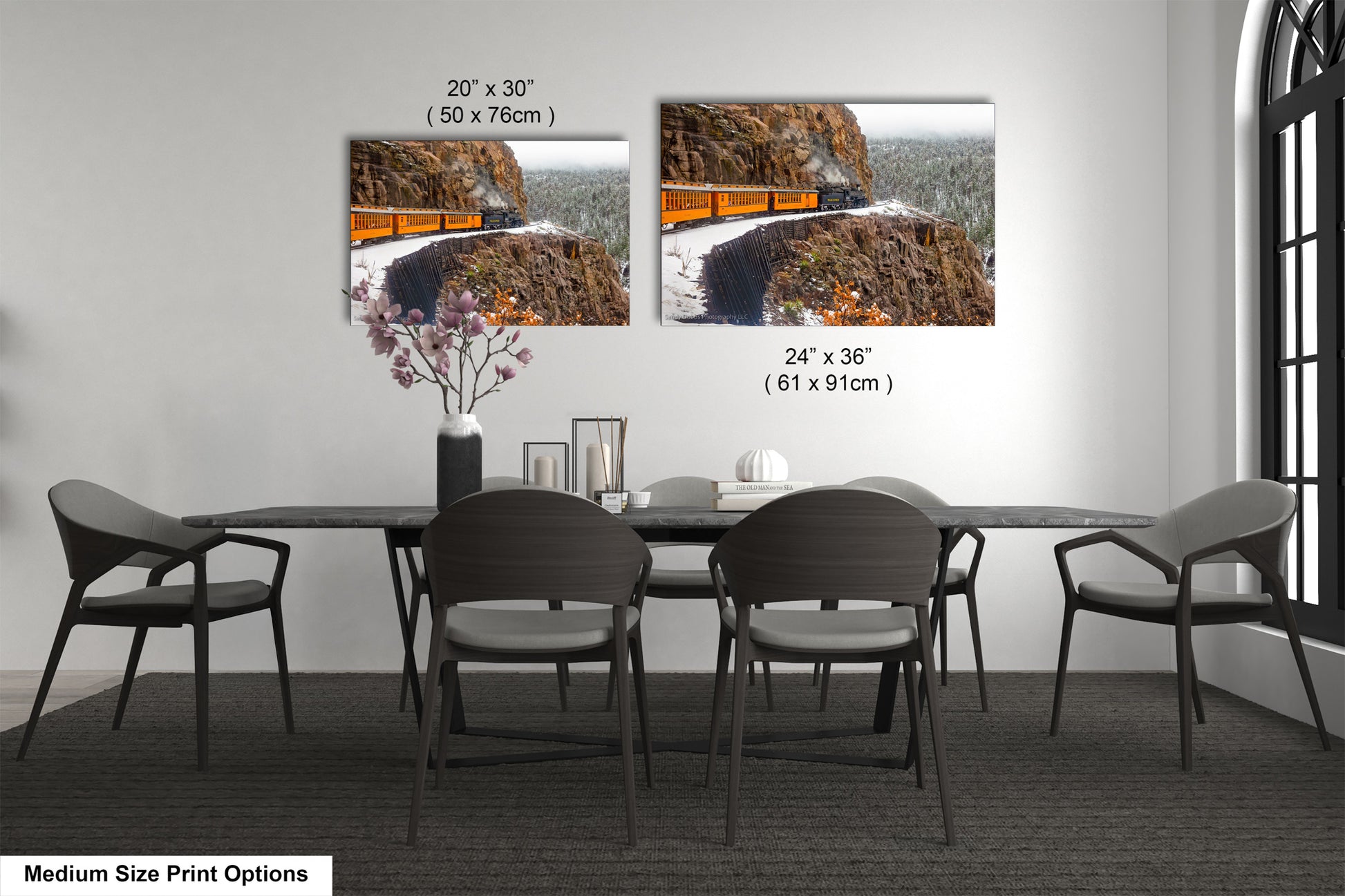 a dining room table with chairs and a picture of a road