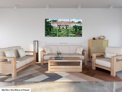 a living room filled with furniture and a painting on the wall