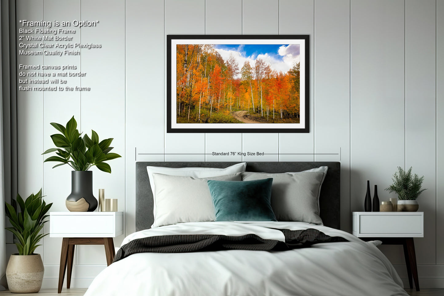 a bedroom with a bed and a picture hanging on the wall