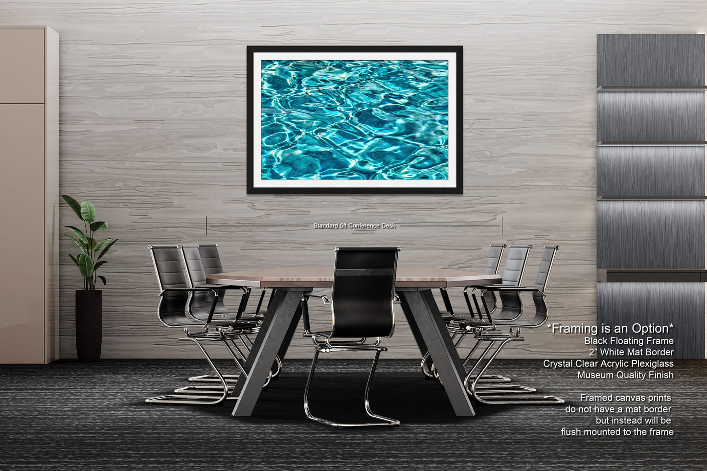 a modern office space with a large framed artwork of a blue water surface hanging on the wall above a wooden table surrounded by black chairs.