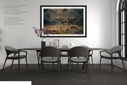 a dining room with a table and chairs and a picture of a horse on the