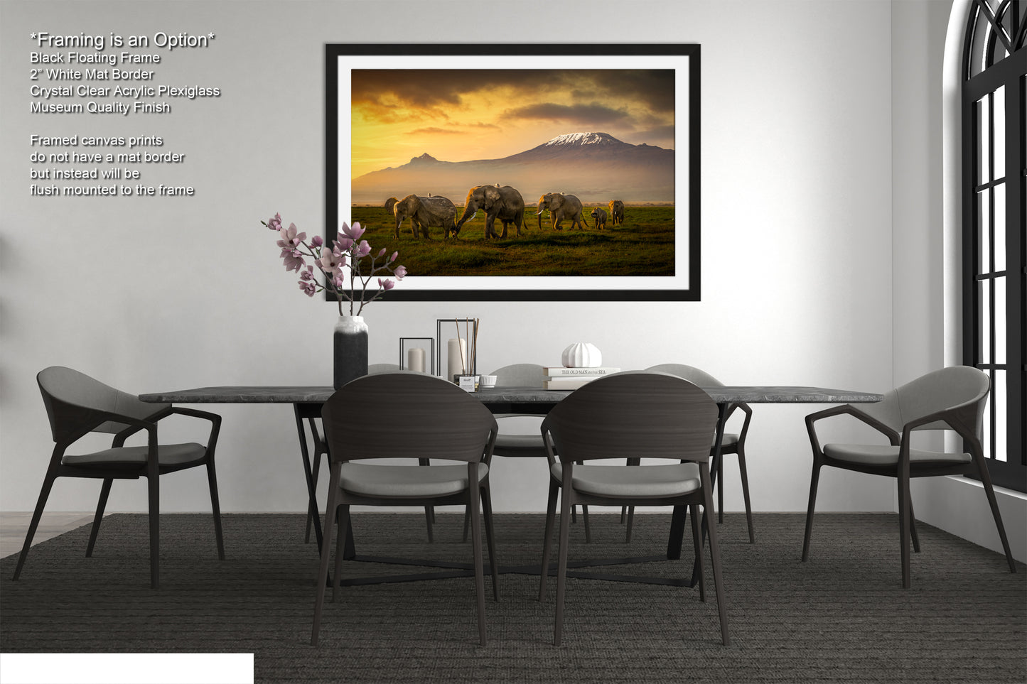 a dining room table with chairs and a painting on the wall