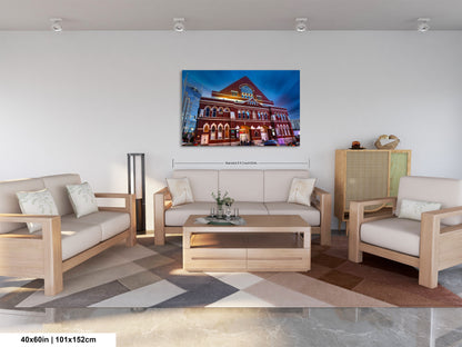a living room filled with furniture and a painting on the wall