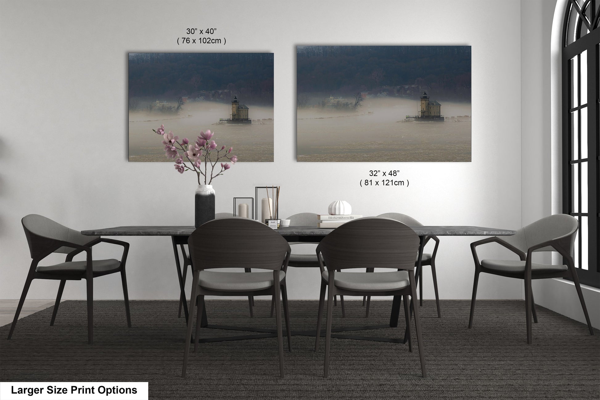 a dining table with four chairs and a vase of flowers